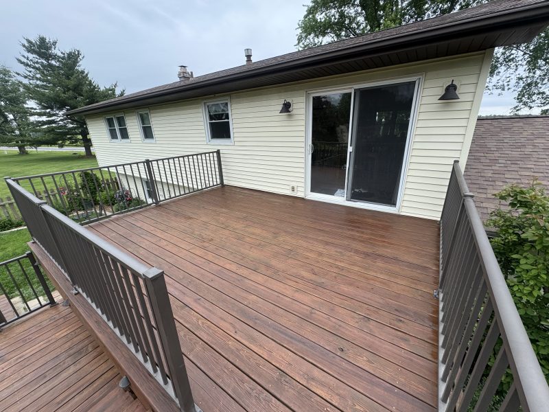 Small restored deck with rich brown solid stain finish and darker railings, back of home, TD Surface Stain and Seal Springfield IL